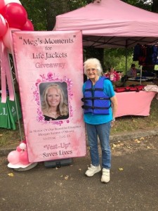 Image of Meg O'Meara honoring her memory with a happy helper to fit life jackets