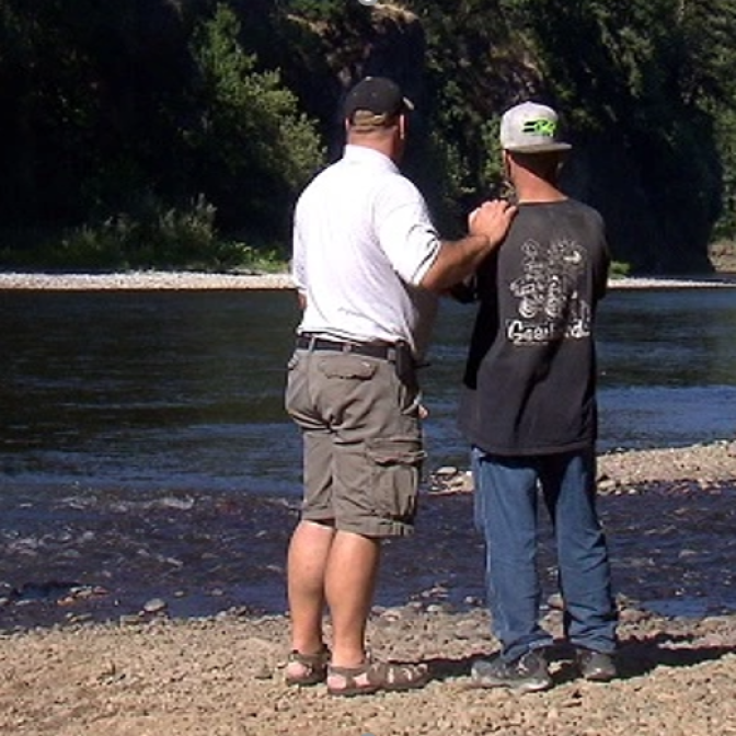 Rob O'Meara and Jack Eichhorn on the Clackamas River bank near the location where Meg's body was recovered. Photo from koin.com